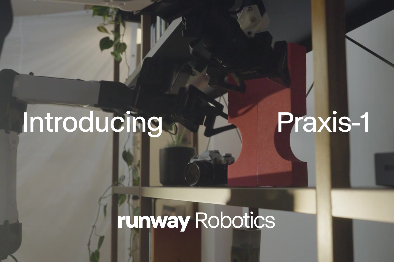로봇 팔이 선반 위 빨간 블록을 집는 장면과 Runway Robotics Praxis-1 소개 문구